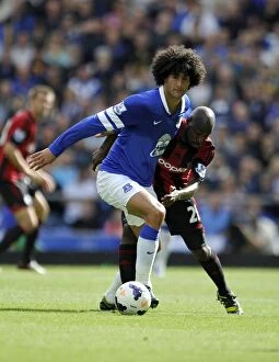 Images Dated 24th August 2013: Battle for the Ball: Fellaini vs. Mulumbu - Everton vs. West Bromwich Albion