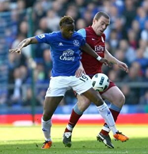 Images Dated 2nd April 2011: Battle for the Ball: Gueye vs. Dunne - Everton vs. Aston Villa Rivalry in the Premier League