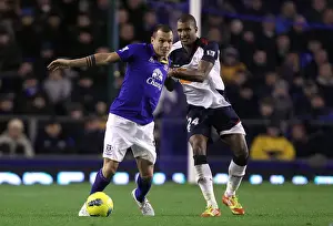 A Battle for the Ball: Heitinga vs Ngog at Goodison Park - Everton vs Bolton Wanderers (Barclays Premier League, 04 January 2012)