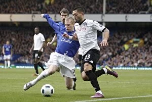Images Dated 19th March 2011: Battle for the Ball: Hibbert vs. Dempsey - Everton vs. Fulham, Premier League (19 March 2011)