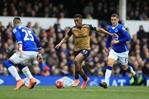 Images Dated 19th March 2016: Battle for the Ball: Iwobi vs. Besic - Everton vs. Arsenal's Premier League Showdown at Goodison