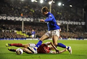 Images Dated 21st March 2012: Battle for the Ball: Jelavic vs. Koscielny - Everton vs. Arsenal