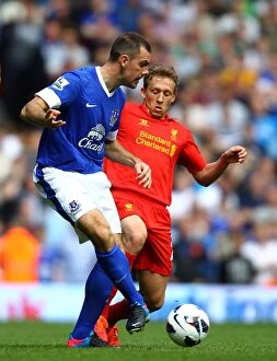 Images Dated 5th May 2013: Battle for the Ball: Leiva vs. Gibson - Liverpool vs. Everton Rivalry in the Barclays Premier