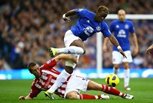 Images Dated 30th October 2010: A Battle for the Ball: Louis Saha vs Danny Collins at Goodison Park - Everton vs Stoke City