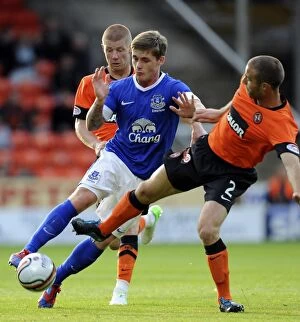 Images Dated 19th July 2012: Battle for the Ball: McAleny vs. Dillon - Pre-Season Clash at Tannadice Park