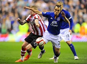 Images Dated 27th March 2012: Battle for the Ball: McClean vs. Osman - FA Cup Sixth Round Replay: Sunderland vs