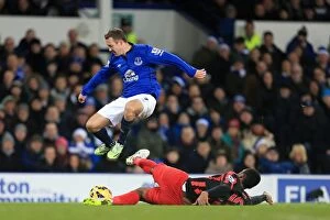 Images Dated 15th December 2014: Battle for the Ball: McGeady vs. Fer - Everton vs. Queens Park Rangers, Premier League Rivalry