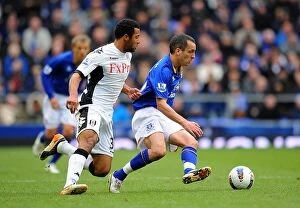 Images Dated 28th April 2012: Battle for the Ball: Osman vs. Dembele - Everton vs. Fulham, Premier League Rivalry (2012)