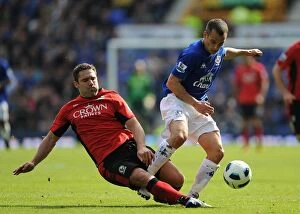 16 April 2011 Everton v Blackburn Rovers Collection: Battle for the Ball: Osman vs. Dunn - Everton vs. Blackburn Rovers