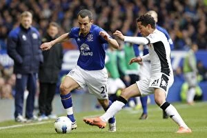 Images Dated 28th April 2012: A Battle for the Ball: Osman vs. Frei at Goodison Park (Everton vs. Fulham, April 2012)
