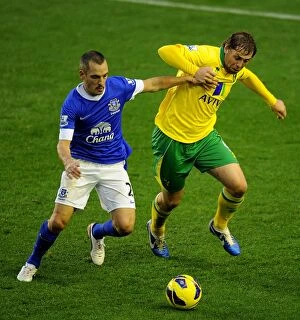 Everton 1 v Norwich City 1 : Goodison Park : 24-11-2012 Collection: Battle for the Ball: Osman vs. Holt - Everton vs. Norwich City's Thrilling 1-1 Premier League