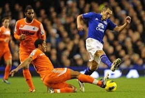Images Dated 21st December 2011: Battle for the Ball: Osman vs. Williams - Everton vs. Swansea City Rivalry in the Premier League