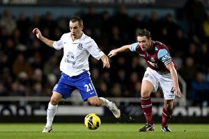 West Ham United 1 v Everton 2 : Upton Park : 22-12-2012 Collection: Battle for the Ball: Osman's Triumph over Nolan in Everton's 2-1 Victory (BPL 2012)