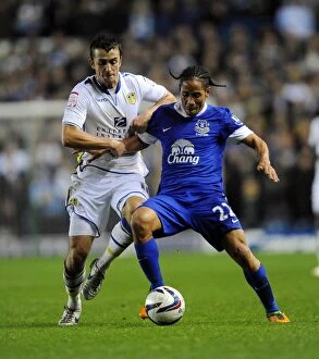 Images Dated 25th September 2012: Battle for the Ball: Pienaar vs. Pugh - Capital One Cup Clash at Elland Road
