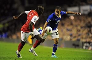 Images Dated 21st March 2012: Battle for the Ball: Pienaar vs. Sagna - Everton vs. Arsenal Rivalry in the Premier League