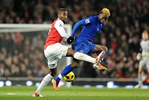Images Dated 2nd February 2011: Battle for the Ball: Saha vs. Djourou - Arsenal vs. Everton, Premier League (February 1, 2011)