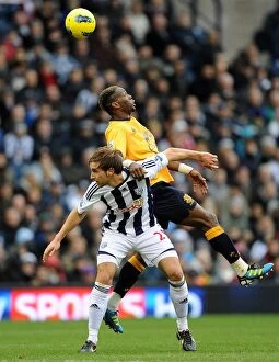 Images Dated 1st January 2012: Battle for the Ball: Saha vs Morrison - Everton vs West Bromwich Albion (01 January 2012)