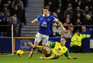 Images Dated 11th January 2014: Battle for the Ball: Seamus Coleman vs. Ryan Bennett - Everton's Victory over Norwich City in