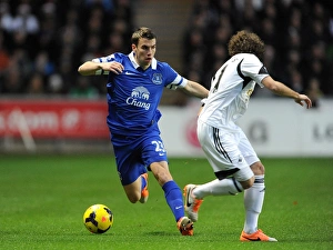Swansea City 1 V Everton 2 : Liberty Stadium : 22-12-2013 Prints: Battle for the Ball: Seamus Coleman's Triumph over Jose Alberto Canas (Everton's Victory at Swansea City)