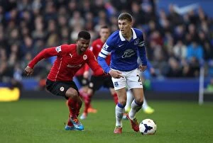 Images Dated 15th March 2014: Battle for the Ball: Stones vs. Campbell - Everton's Narrow Victory over Cardiff City (15-03-2014)