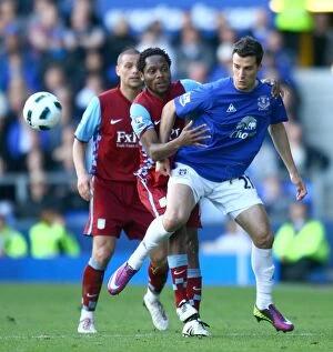 Images Dated 2nd April 2011: Battle for the Ball: Vellios vs. Makoun - Everton vs. Aston Villa Rivalry in the Barclays Premier