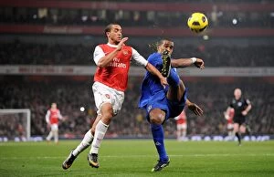 Images Dated 2nd February 2011: Battle for the Ball: Walcott vs. Distin - Arsenal vs. Everton Rivalry (01 February 2011)