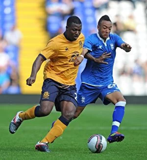 30 July 2011 Birmingham City v Everton Collection: Battle for the Ball: Yakubu (Everton) vs. Redmond (Birmingham City)