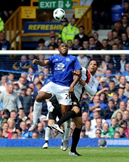 Battle at Goodison Park: Anichebe vs. Lescott - Everton vs. Manchester City (07 May 2011) - Intense Rivalry on the Football Field