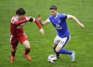 Everton 2 V Queens Park Rangers 0 : Goodison Park : 13-04-2013 Prints: Battle at Goodison Park: Mirallas vs. Park Ji-Sung