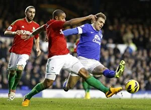 Images Dated 12th January 2013: Battle at Goodison Park: Williams vs Jelavic - Everton vs Swansea City Stalemate (January 12, 2013)