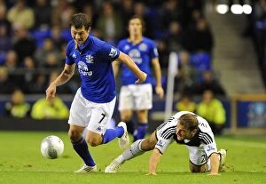 Images Dated 26th October 2011: Battling for Control: Ivanovic vs. Bilyaletdinov in the Carling Cup Showdown at Goodison Park