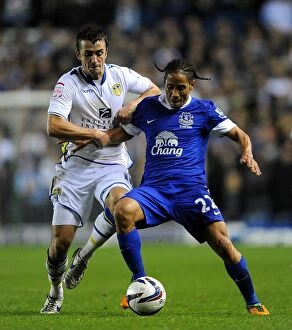 Images Dated 25th September 2012: Battling for Control: Pugh vs. Pienaar in the Intense Capital One Cup Clash between Leeds United