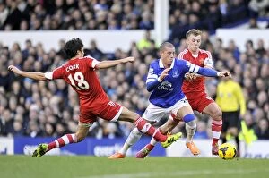 Images Dated 29th December 2013: Battling Midfielders: Ross Barkley's Tussle with Ward-Prowse and Cork (Everton vs. Southampton)