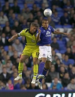Images Dated 24th August 2011: Carling Cup Showdown: Rodwell vs Cresswell Clash at Goodison Park (2011)