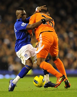 Clash at Goodison Park: Royston Drenthe vs Kemy Agustien - A Battle for Ball Supremacy (Everton vs Swansea City, Barclays Premier League, 21 December 2011)