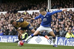 Everton v Arsenal - Goodison Park Collection: Clash at Goodison Park: Stones vs. Iwobi in Premier League Showdown