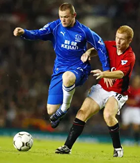 Wayne Rooney Prints: Clash at Old Trafford: Scholes vs Rooney - Manchester United's Iconic Rivalry