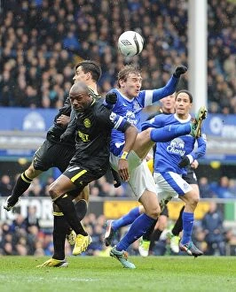 Images Dated 9th March 2013: Clash in the Quarter-Finals: Jelavic vs. Boyce and Scharner - Everton vs. Wigan Football Rivalry