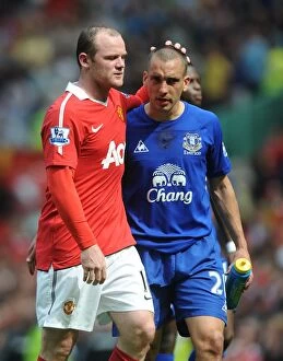 23 April 2011 Manchester United v Everton Collection: A Clash of Red and Blue: Leon Osman vs. Wayne Rooney - Manchester United vs