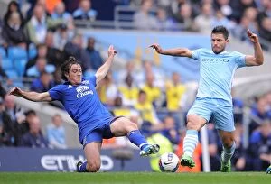 Images Dated 24th September 2011: Clash of Titans: Leighton Baines vs. Sergio Aguero - Manchester City vs