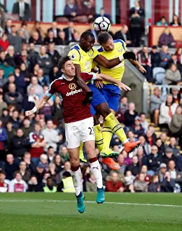 Soccer Football Prints: Clash at Turf Moor: Jagielka and Bolasie Battle Ward for Ball Control in Everton vs Burnley Premier League Encounter