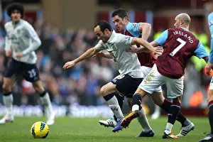 Clash at Villa Park: Landon Donovan Fights for Possession against Ciaran Clark and Stephen Ireland