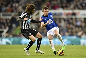 Framed Print : Coloccini vs. Baines: Intense Clash Between Newcastle's Fabricio Coloccini and Everton's Leighton Baines in Premier League Encounter Framed Print : Coloccini vs. Baines: Intense Clash Between Newcastle's Fabricio Coloccini and Everton's Leighton Baines in Premier League Encounter