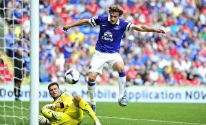 Images Dated 31st August 2013: David Marshall vs. Nikica Jelavic: A Battle of the Strikers at Cardiff City Stadium - Everton vs