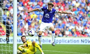 Season 2013-14 Prints: David Marshall vs. Nikica Jelavic: A Battle of the Strikers at Cardiff City Stadium - Everton vs