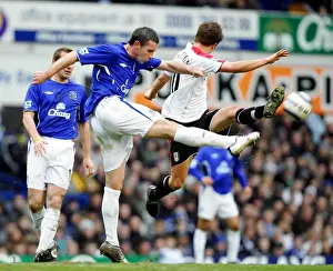 David Weir Prints: David Weir vs. Brian McBride: A Football Rivalry - Everton vs. Fulham