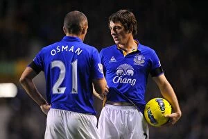 Images Dated 4th December 2011: Deep in Conversation: Leighton Baines and Leon Osman at Goodison Park during Everton vs Stoke City