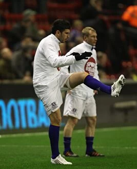 Images Dated 13th March 2012: Denis Stracqualursi of Everton Stretching During Warm-Up Ahead of Liverpool Clash (13 March 2012)