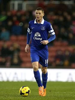 Stoke City 1 v Everton 1 : Britannia Stadium : 01-01-2014 Collection: Determined James McCarthy: A Standout Performance in the 1-1 Stalemate at Britannia Stadium