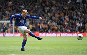 06 May 2012 v Wolverhampton Wanderers, Molineux Stadium Collection: Determined Moment: Tony Hibbert's Shot at Goal for Everton vs